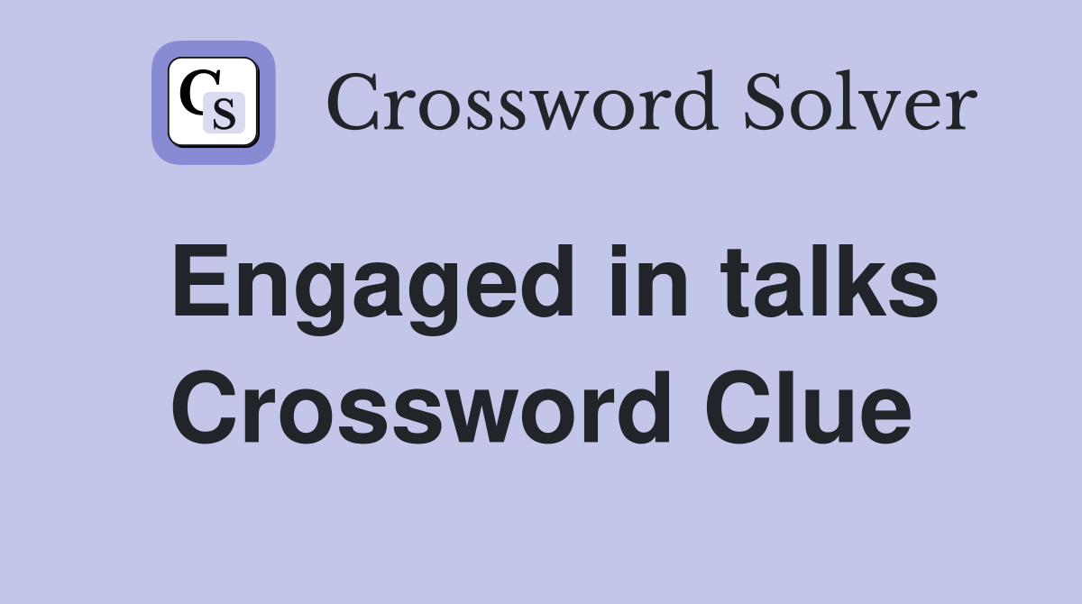 Engaged in talks Crossword Clue