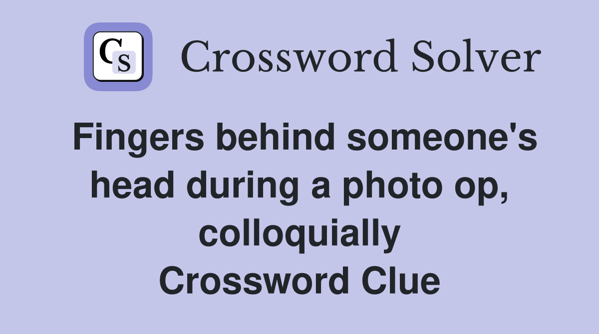 Fingers behind someone's head during a photo op, colloquially Crossword Clue
