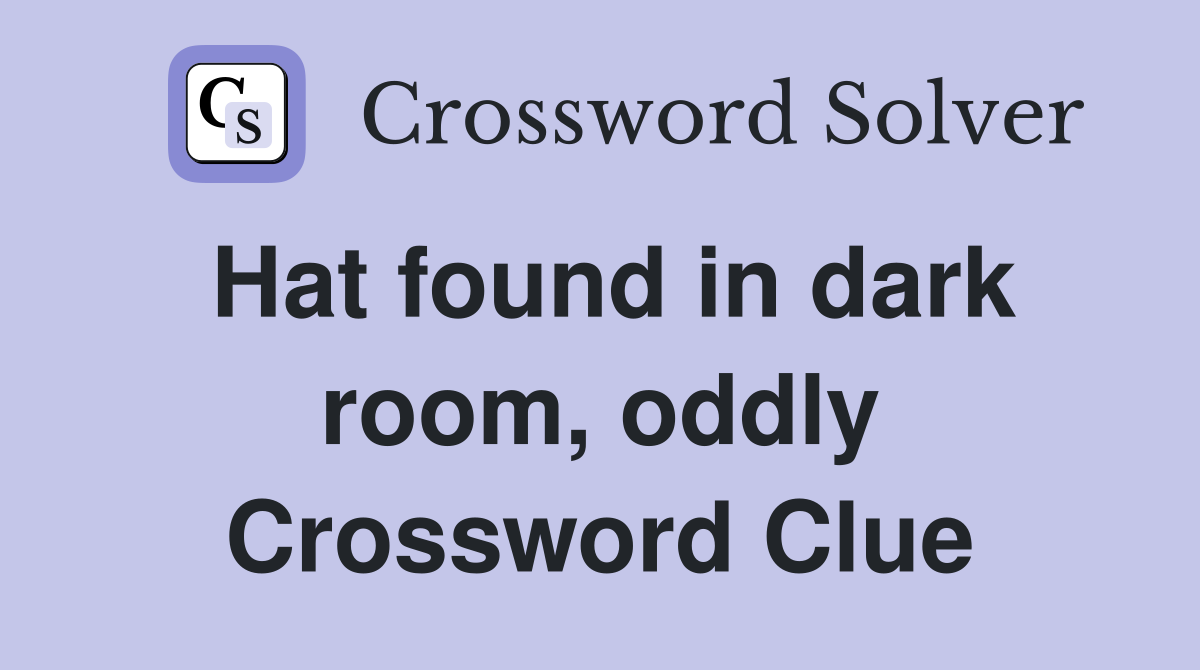 Hat found in dark room, oddly Crossword Clue