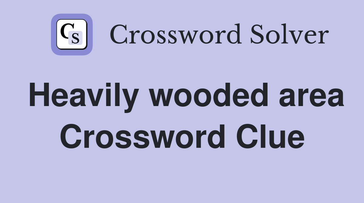 Heavily wooded area Crossword Clue