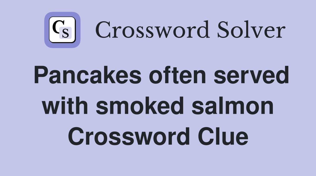 Pancakes often served with smoked salmon Crossword Clue