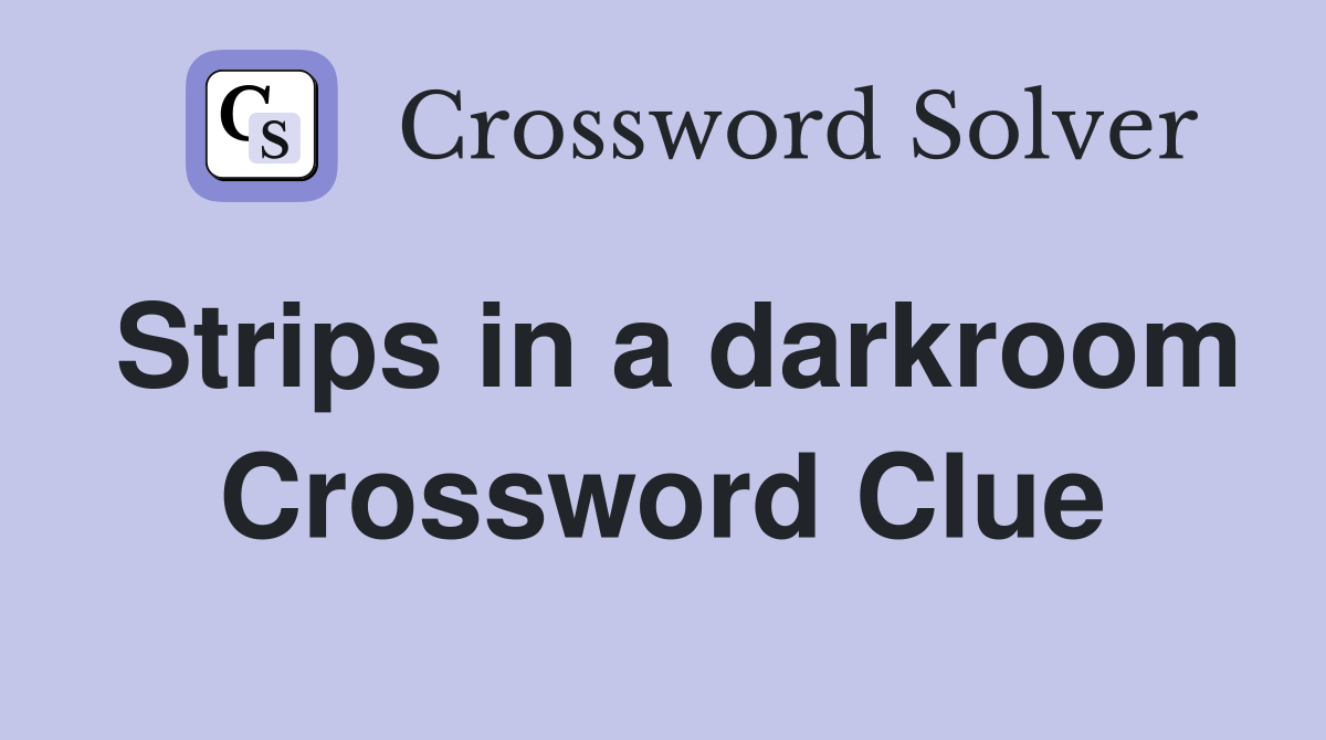 Strips in a darkroom Crossword Clue