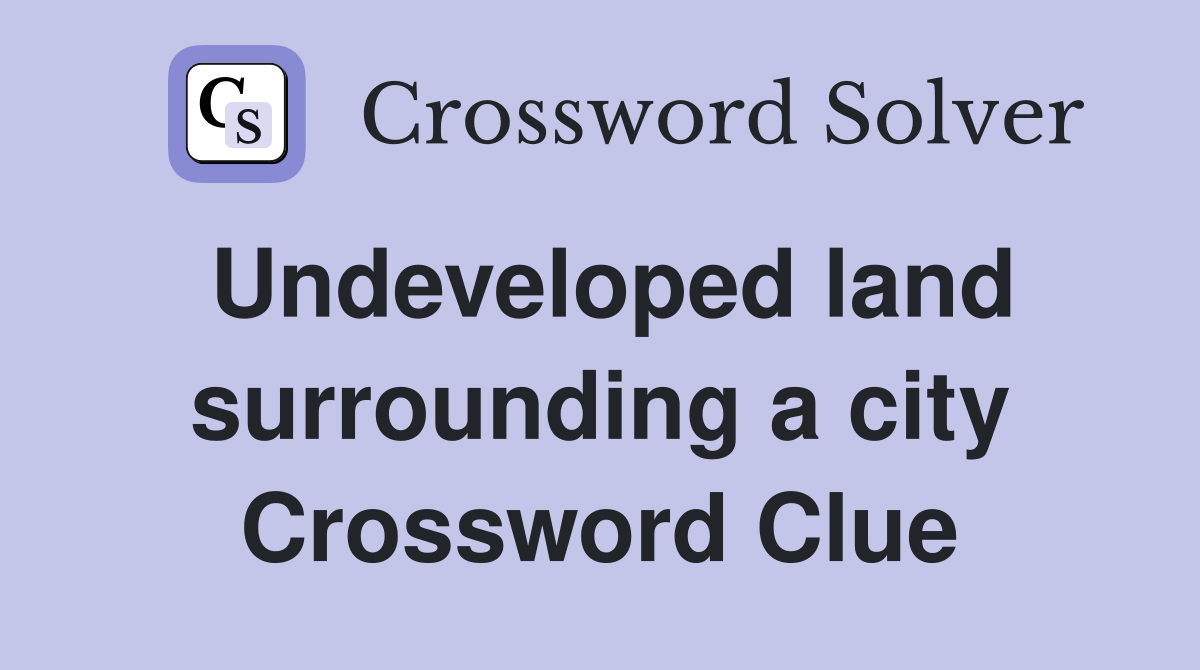 Undeveloped land surrounding a city Crossword Clue