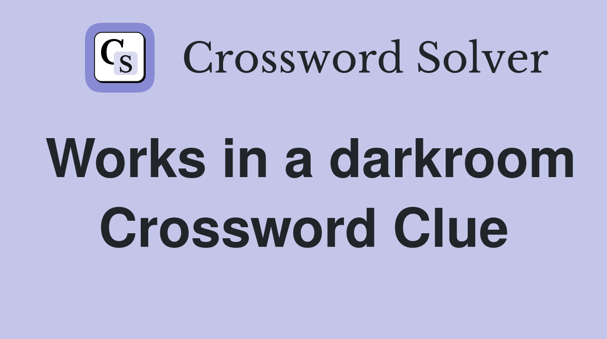 Works in a darkroom Crossword Clue